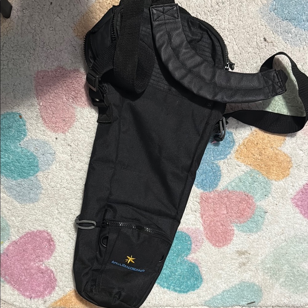 Black Sling oxygen tank carrier bag.